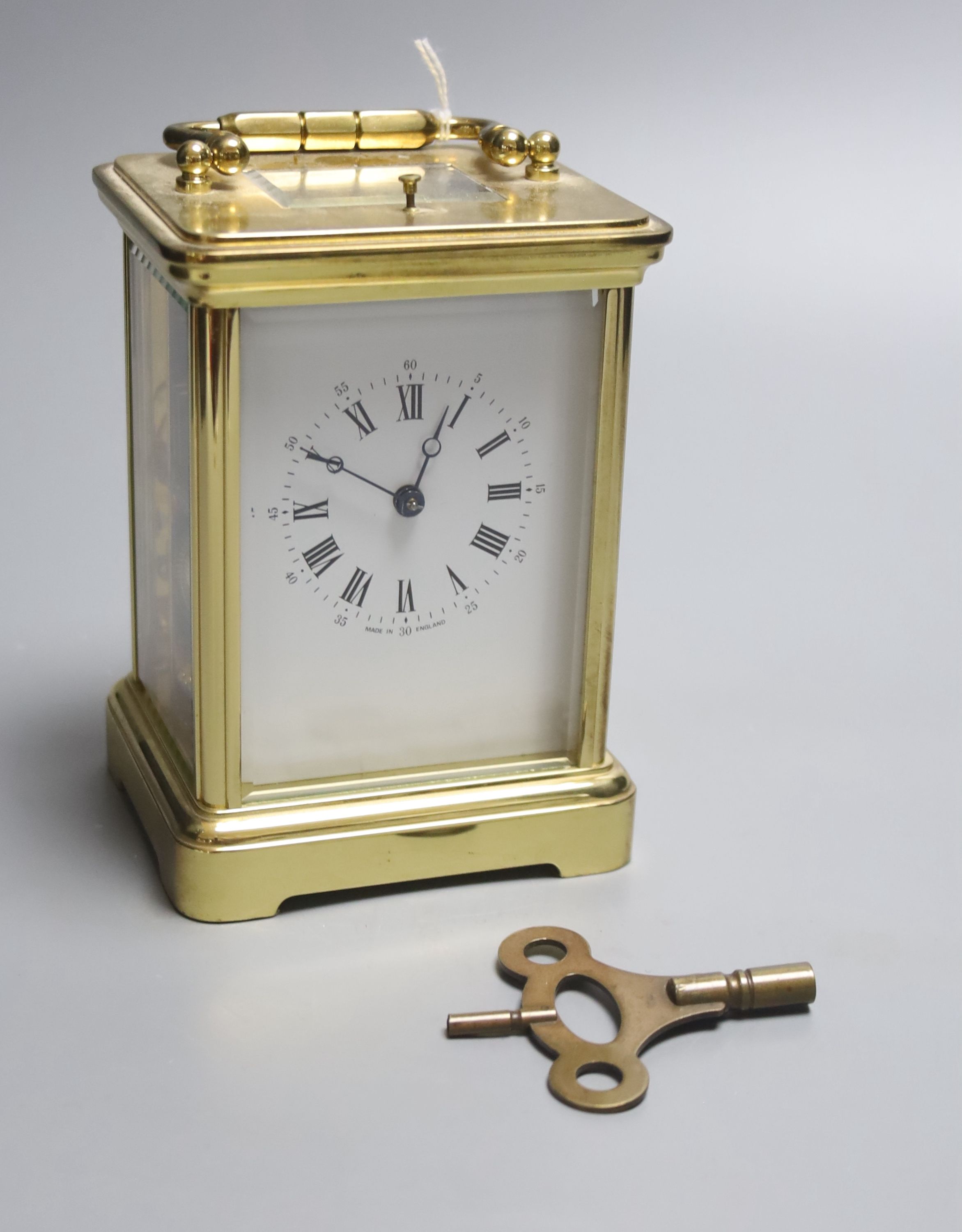 A brass cased hour repeating carriage clock, height 14.5cm